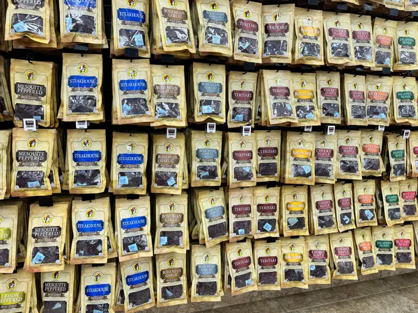 stock image Temple, Texas - June 28, 2024: Huge selection of flavored beef jerky for sale at a Buc-Ees gas station and store