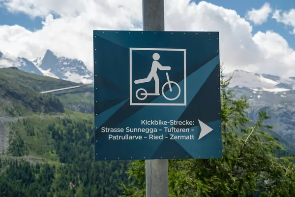 stock image Sign reminding riders to return their trottibikes or kick bikes to the Sunnega station in Zermatt Switzerland