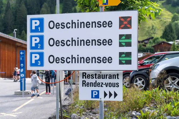 Stock image Kandersteg, Switzerland - July 24, 2024: Parking lot information near the gondola lift for visiting Oeschinensee Lake