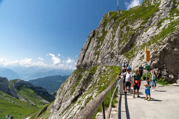 stock image Pilatus, Switzerland - July 19, 2024: Tourists and hikers enjoy the viewpoints from the top of Mt Pilatus in Switzerland in summer