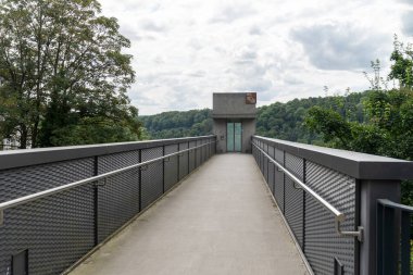 Schaffhausen Canton, Switzerland - July 17, 2024: Elevator for tourists takes people down to the viewing area of Rhine Falls (Rhinefall) clipart