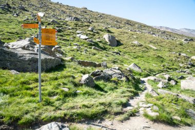 Hiking trail directional signs post, along the Five Lakes Trail - Zermatt, Switzerland clipart