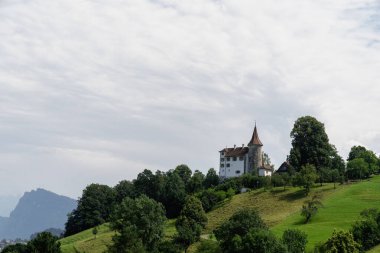 Castle at Kreins, Switzerland on a hill - Schloss Schauensee clipart