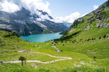 Hiking trail along the Oeschinensee Lake hike in Switzerland clipart