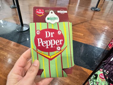 Waco, Texas - November 11, 2024: Vintage style can koozie holder for sale at the gift shop in the Dr Pepper museum clipart