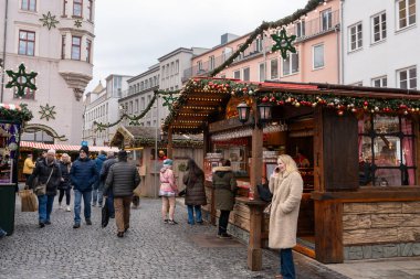 Augsburg, Germany - December 3, 2024: People enjoying visiting an Augsburg Germany Christmas Market clipart