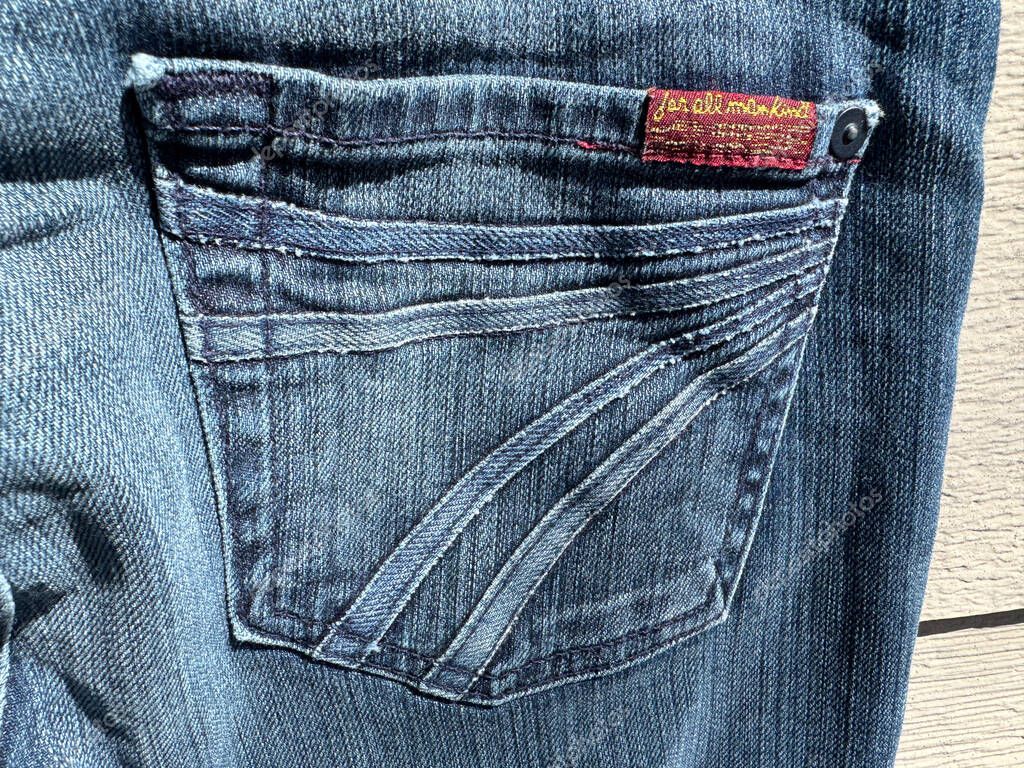 New Hope, Minnesota - April 5, 2025: Close up logo of a Seven for All Mankin premium designer denim jeans back pocket