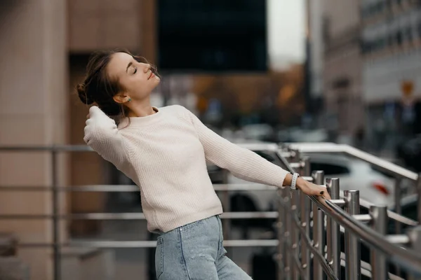 stock image Professional woman worker wear suit standing outdoor terrace with a big smile leaning on railing enjoy view from modern office skyscraper.