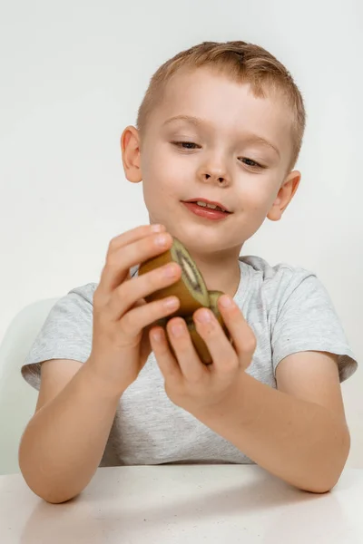 Boy Having Fun Studio Grey Background Cute Kid Kiwi Isolated — Stock Photo, Image