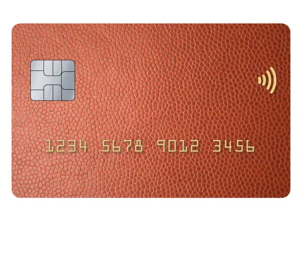 stock image A credit card with the texture of a leather football or basketball is seen in a 3-d illustration about online sports betting.