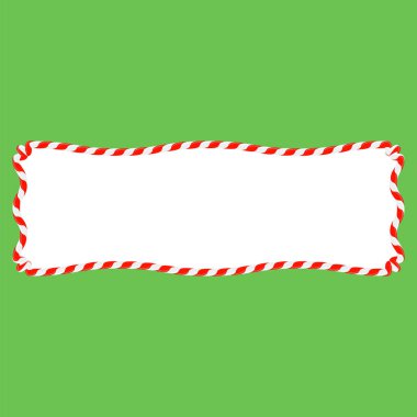 Yeşil arka planda kırmızı ve beyaz çizgili Noel şekeri çerçevesi. Xmas sınırı.