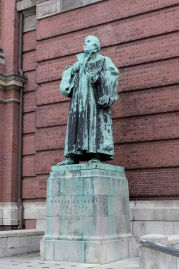 Bronze sculpture of Martin Luther in front of the Church of St. Michael in Hamburg, Germany