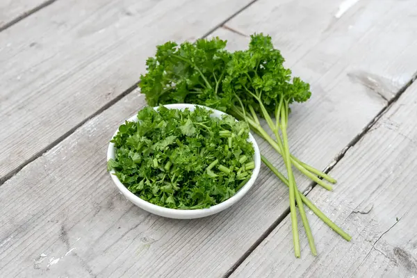Bunch Sliced Fresh Curly Parsley Light Wooden Background Stock Photo
