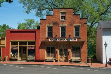 Coshocton, OH, USA - May 15, 2023: The Roscoe General Store is just one of several charming old businesses and residences that have been restored to new life in historic Roscoe Village. clipart