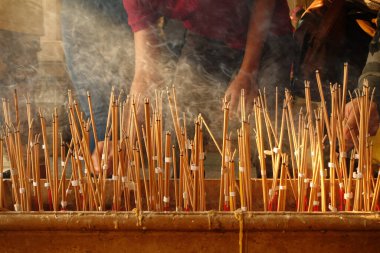 Incense in joss stick pot with Buddha statue to make a wish in the temple Thailand,Incense that was lit to worship,Make merit for Temple Thailand (Visakha Puja Day,Asalha Puja Day,Magha Puja Day)