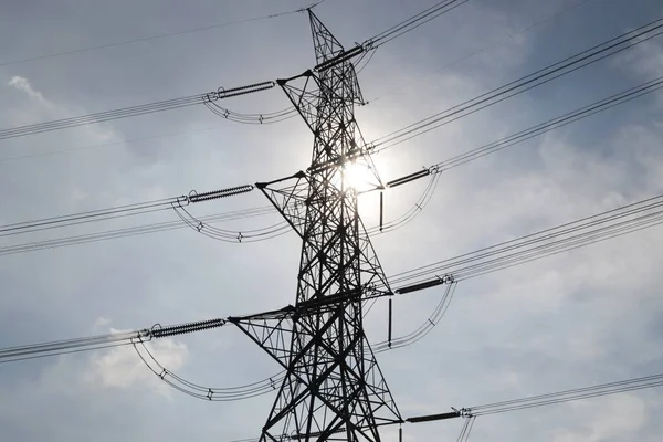 High voltage post with the sunlight at Thailand 