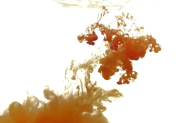 Orange color dye melt in water on white background,Abstract smoke pattern,Colored liquid dye,Splash paint