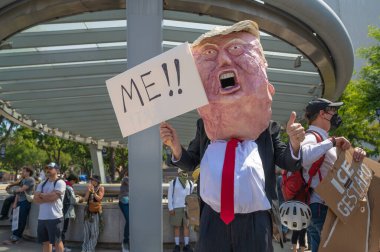 Los Angeles, California, USA, July 14, 2025, Protester in a Donald Trump costume during the No Kings protest against government policies and supporting democracy and immigrant rights