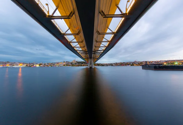 stock image New Halic Metro Bridge at summer night blue sky and city lights in Istanbul, Turkey