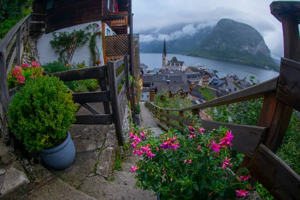 stock image Scenic panoramic view of famous Hallstatt lakeside town reflecting in Hallstattersee lake in the Austrian Alps in scenic morning light on a beautiful sunny day in summer, Salzkammergut region, Austria