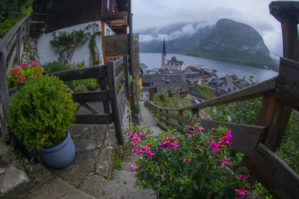 stock image Scenic panoramic view of famous Hallstatt lakeside town reflecting in Hallstattersee lake in the Austrian Alps in scenic morning light on a beautiful sunny day in summer, Salzkammergut region, Austria