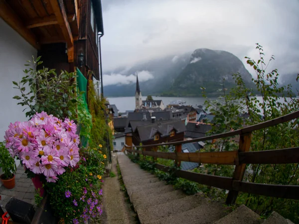 stock image Scenic panoramic view of famous Hallstatt lakeside town reflecting in Hallstattersee lake in the Austrian Alps in scenic morning light on a beautiful sunny day in summer, Salzkammergut region, Austria