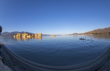 Bafa lake is a peaceful place, ringed by traditional villages such as Kapkr full of fisherman boats and ruins of Herakleia