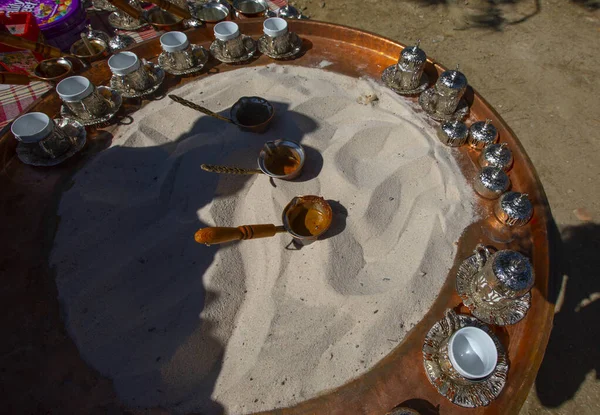 stock image Turkish coffee brewing process in the sand and elderflower syrup, Sirince, zmir, Turkey.