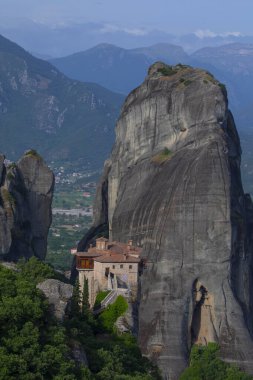 Magnificent mountain panorama with Roussanou monastery. Meteora, Kalambaka, Greece. Famous Greek orthodox christian shrine, unique rock formation, Unesco world heritage site. Travel, hiking,