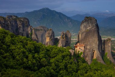 Magnificent mountain panorama with Roussanou monastery. Meteora, Kalambaka, Greece. Famous Greek orthodox christian shrine, unique rock formation, Unesco world heritage site. Travel, hiking,