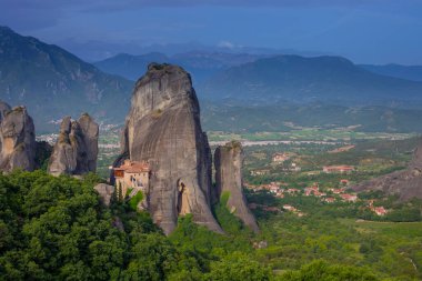 Magnificent mountain panorama with Roussanou monastery. Meteora, Kalambaka, Greece. Famous Greek orthodox christian shrine, unique rock formation, Unesco world heritage site. Travel, hiking,