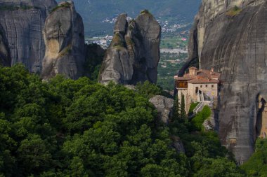 Magnificent mountain panorama with Roussanou monastery. Meteora, Kalambaka, Greece. Famous Greek orthodox christian shrine, unique rock formation, Unesco world heritage site. Travel, hiking,