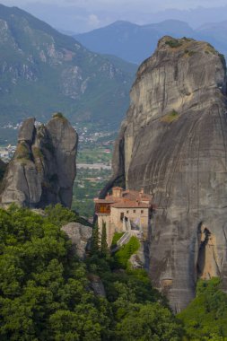 Magnificent mountain panorama with Roussanou monastery. Meteora, Kalambaka, Greece. Famous Greek orthodox christian shrine, unique rock formation, Unesco world heritage site. Travel, hiking,
