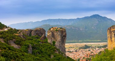 Meteora landmark canyon, Kalambaka, Greece, shadows, meandering road, bridge, mountains like pillars