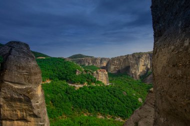 Meteora landmark canyon, Kalambaka, Greece, shadows, meandering road, bridge, mountains like pillars