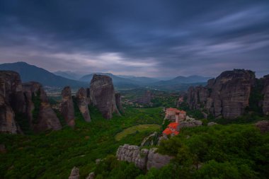 Meteora landmark canyon, Kalambaka, Greece, shadows, meandering road, bridge, mountains like pillars