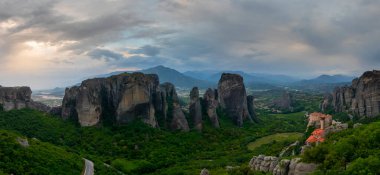 Meteora landmark canyon, Kalambaka, Greece, shadows, meandering road, bridge, mountains like pillars