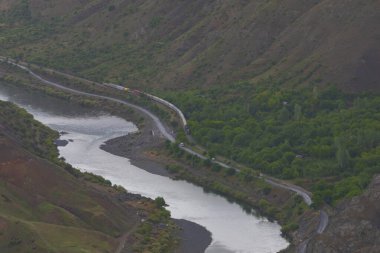 The old Palu Bridge and Black train interlocking iron bridge over the Murat River.