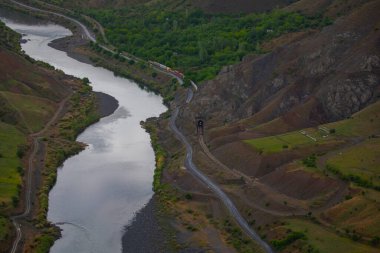 The old Palu Bridge and Black train interlocking iron bridge over the Murat River.