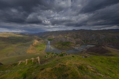 The old Palu Bridge and Black train interlocking iron bridge over the Murat River.