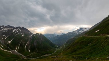 Furka Pass and Grimsel Pass in the swiss alps in early summer with still snow on the mountains