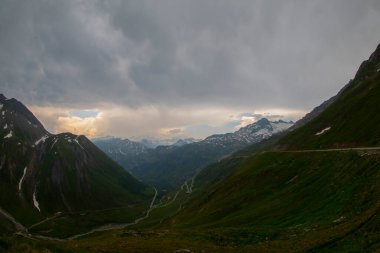 Furka Pass and Grimsel Pass in the swiss alps in early summer with still snow on the mountains