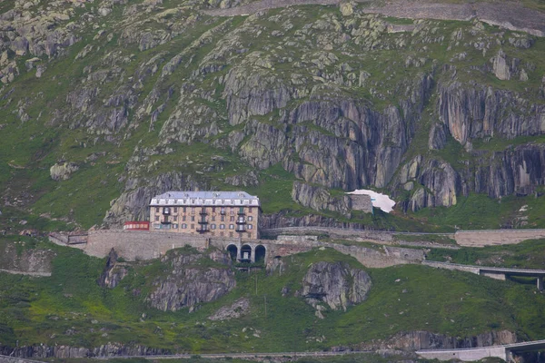The old and closed mountain hotel Belvedere located near the Rhone Glacier at the Furka Pass, Switzerland, Europe
