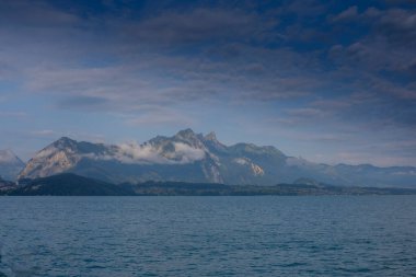 Panoramic view of the Lake Thun (Thunersee) with Bernese Alps on the background