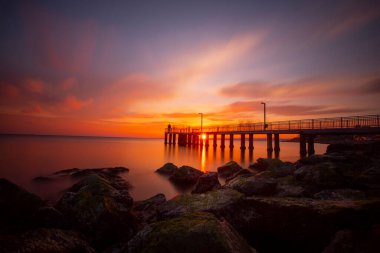 Sunset in Florya and people by sea side.