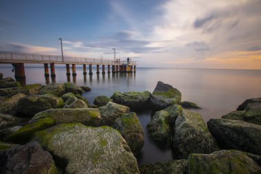 Sunset in Florya and people by sea side.