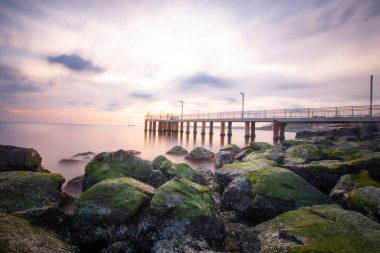 Sunset in Florya and people by sea side.