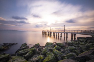Sunset in Florya and people by sea side.