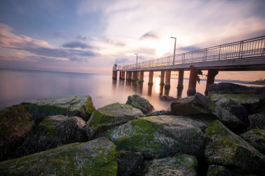 Sunset in Florya and people by sea side.