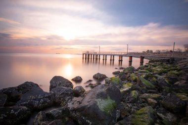 Sunset in Florya and people by sea side.